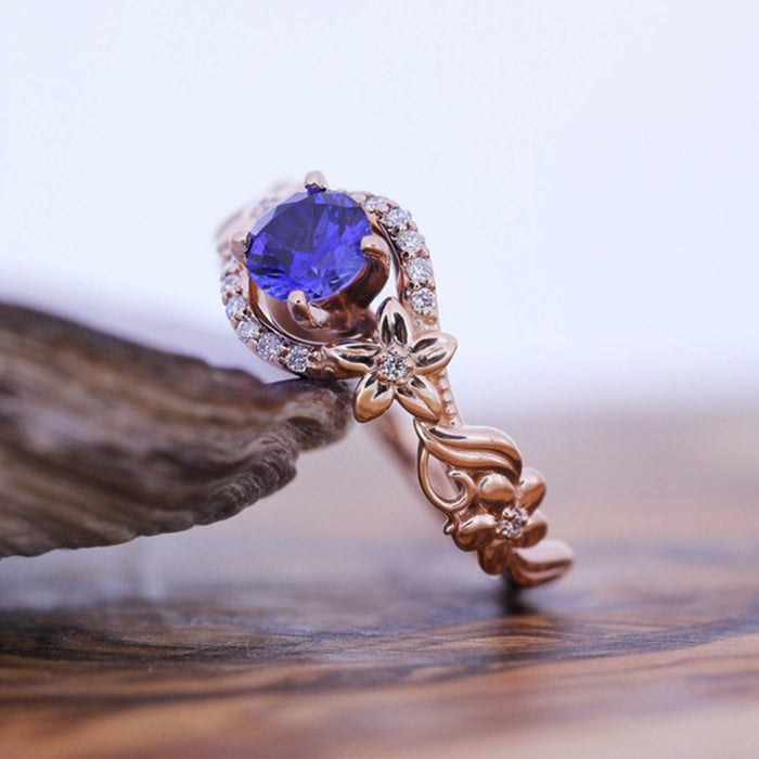 Rose gold flower inlaid royal blue zircon female ring