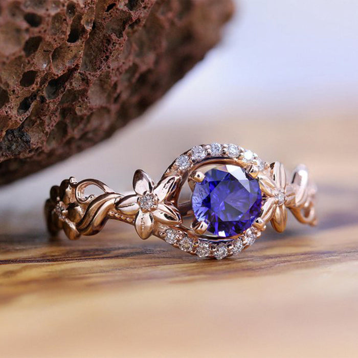 Rose gold flower inlaid royal blue zircon female ring