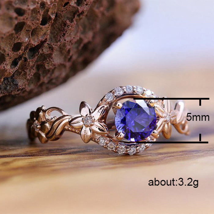 Rose gold flower inlaid royal blue zircon female ring