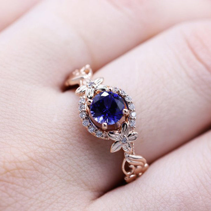 Rose gold flower inlaid royal blue zircon female ring