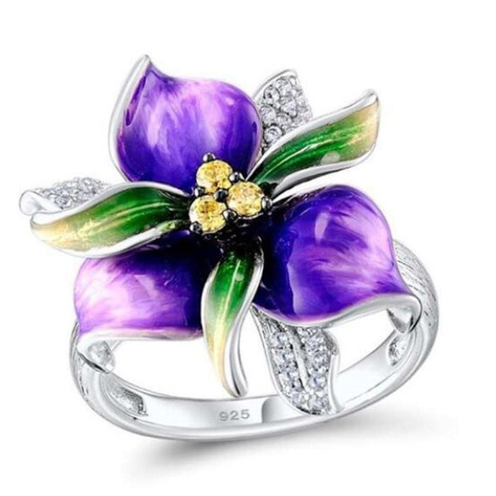 Exquisito anillo de circonita con flor de pegamento morado