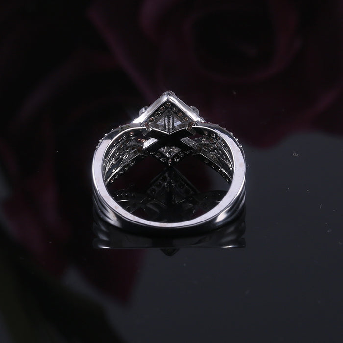 Diamond four-claw zircon ring