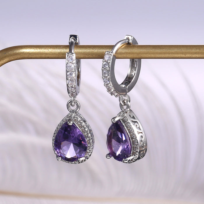 Vintage claw set purple gemstone earrings