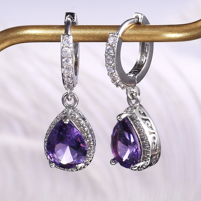 Vintage claw set purple gemstone earrings