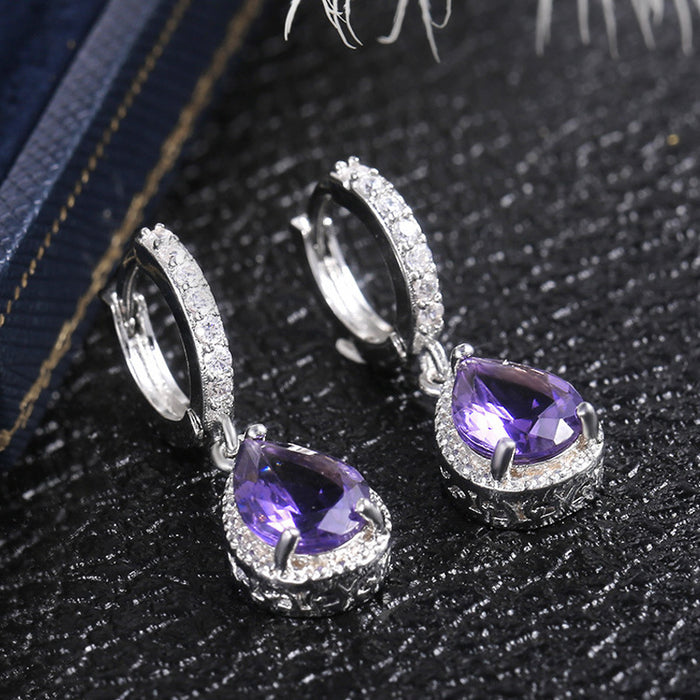 Vintage claw set purple gemstone earrings