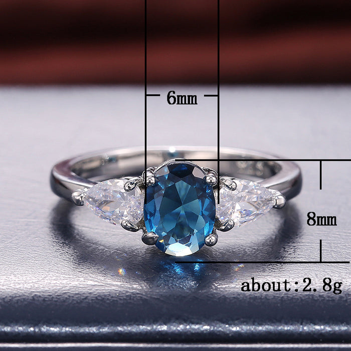 Anillo de lujo para mujer con incrustaciones de circonita azul.