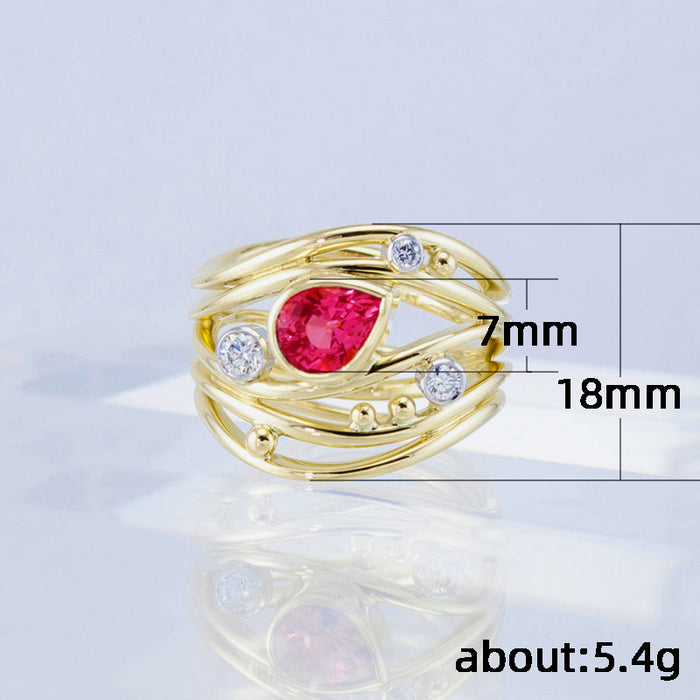 Anillo de circonitas rojas en forma de lágrima de varias líneas