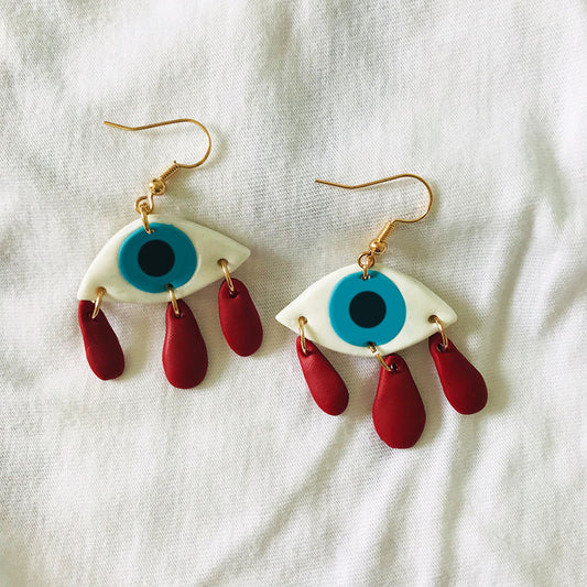 Pendientes de arcilla con forma de luna y ojo de gato fantasma para Halloween: estilo de estudiante espeluznante, tendencia