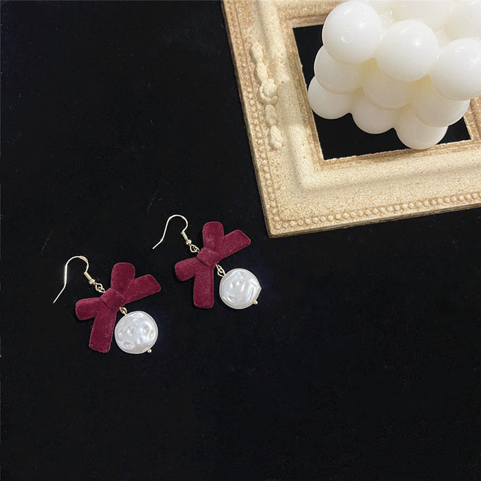 Pearl bow earrings S925 silver needle flocking retro all-match earrings