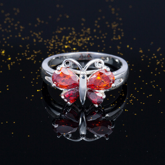 Anillo de corindón rojo con mariposa y circonita, joyería creativa plateada para mujer, venta al por mayor