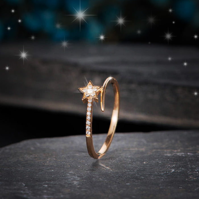 Anillo de mujer con forma de estrella de circonita bañada en oro rosa y diseño de estrella fugaz