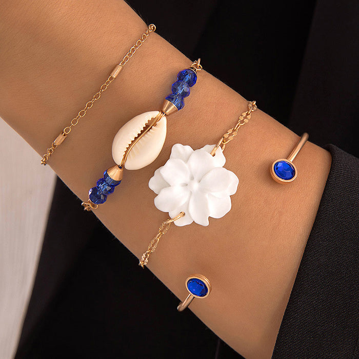 Conjunto de pulseras de conchas y estrellas de mar: cuatro piezas de joyería de aleación de oro para mujer