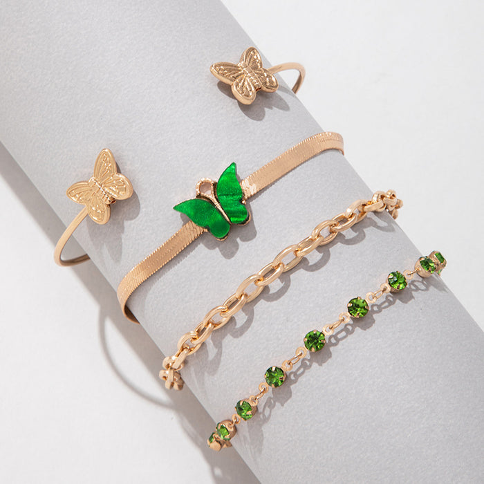 Conjunto de pulseras de diamantes de imitación verdes: brazalete de acrílico y mariposa de cuatro piezas