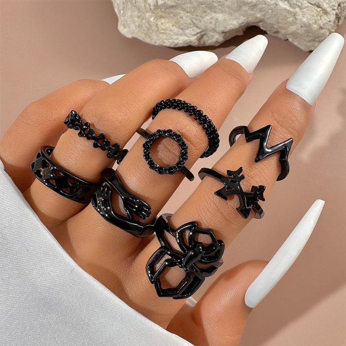 Juego de ocho anillos circulares con diseño de flechas y flores de Dark Love