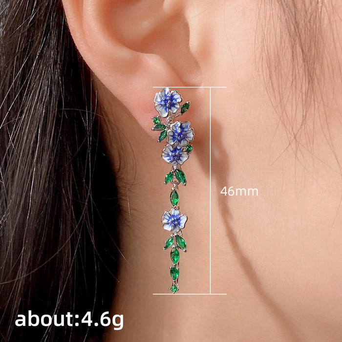 Pendientes de circonitas con forma de flor y gotas de aceite