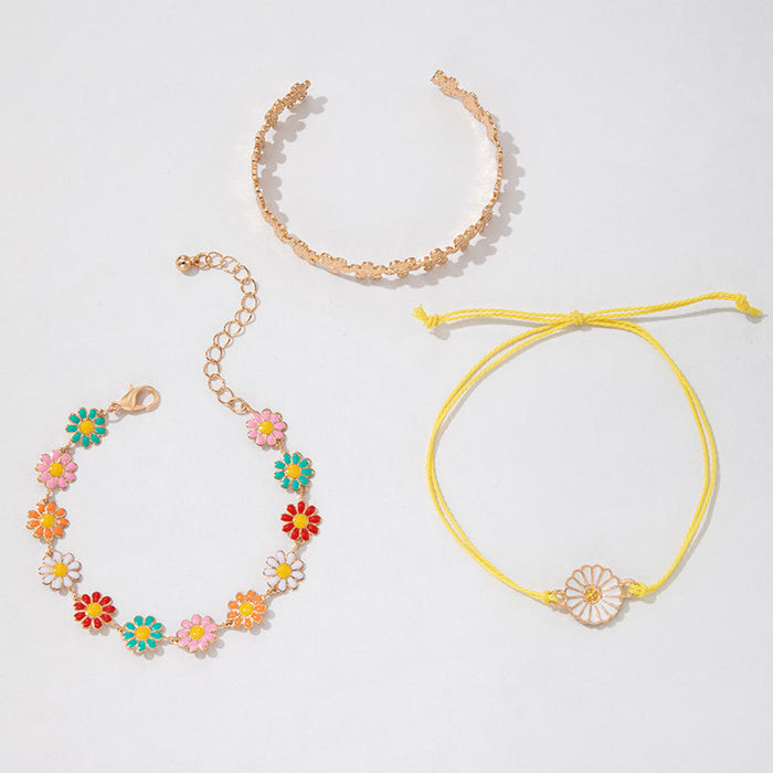 Conjunto de pulseras con flores de margaritas: joyería de mujer en tres piezas en tonos pastel