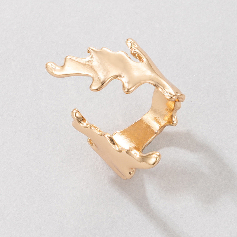 Irregular geometric gold ring with leaf opening