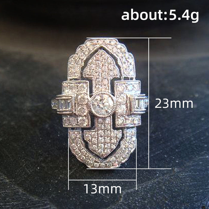 Green gemstone ring with multi-layer diamond design