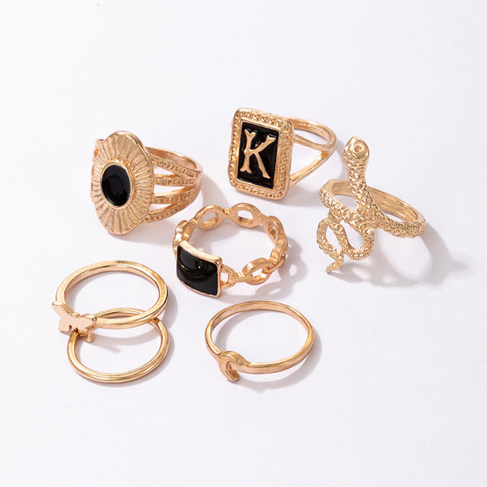 Dark gold letter K snake butterfly seven-piece ring set