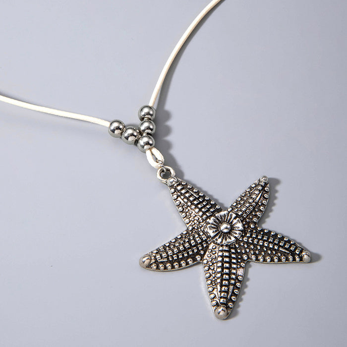 Collar con colgante de estrella de mar bohemio con cuerda de cuero: joyería de estilo playero para hombres y mujeres