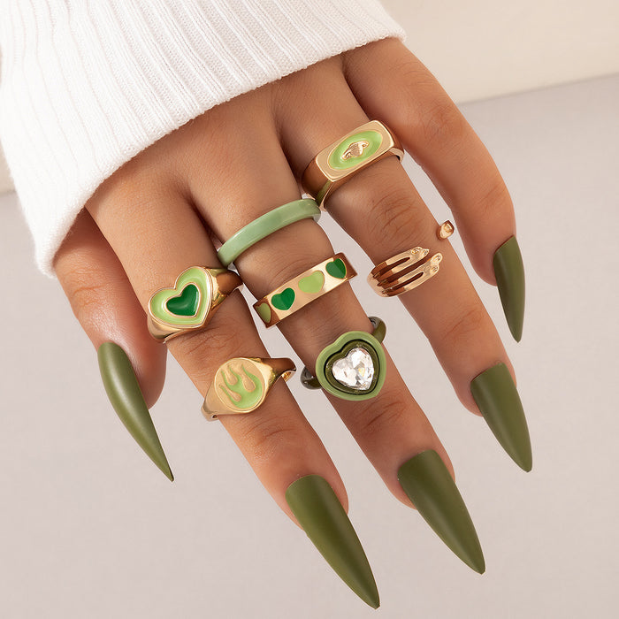 Juego de anillos de palma con forma de llama de amor y goteo de aceite verde, conjunto de siete piezas con forma de corazón de resina geométrica