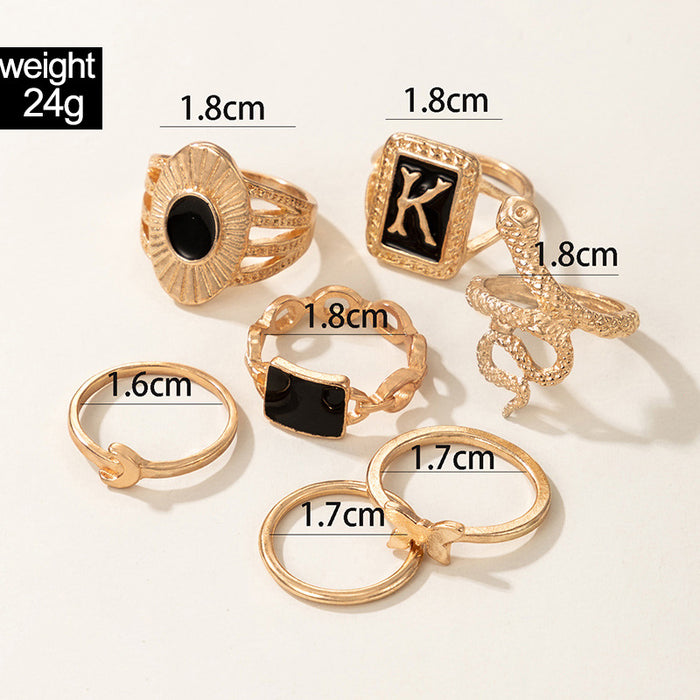 Dark gold letter K snake butterfly seven-piece ring set