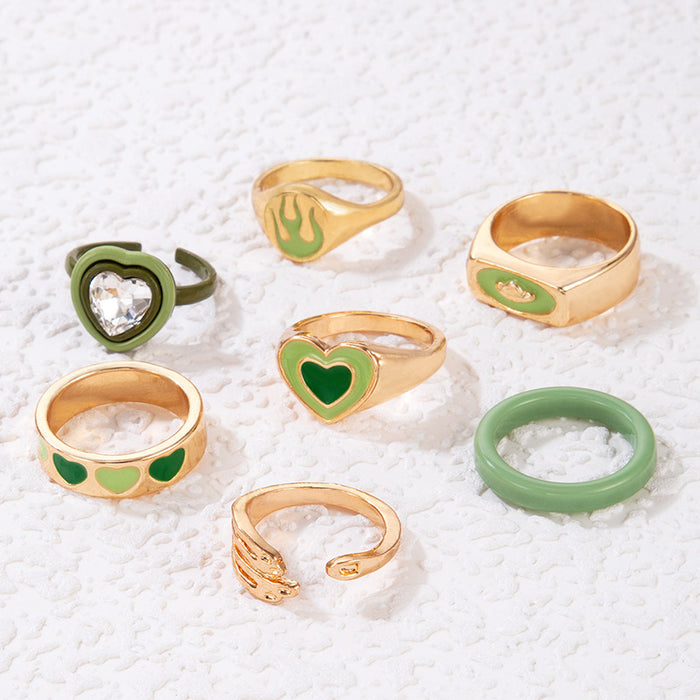 Juego de anillos de palma con forma de llama de amor y goteo de aceite verde, conjunto de siete piezas con forma de corazón de resina geométrica