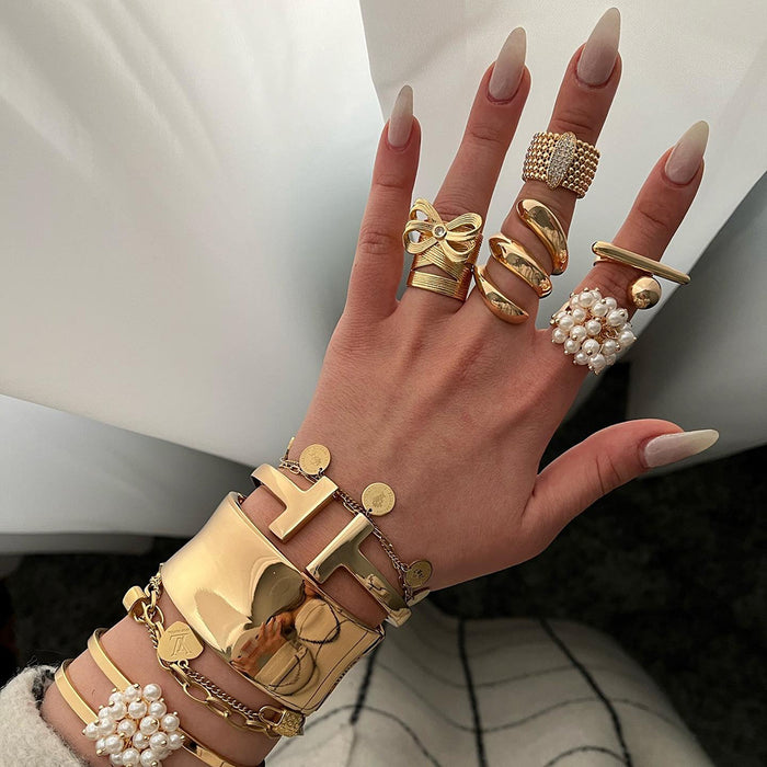 Stainless steel bow ring with diamonds