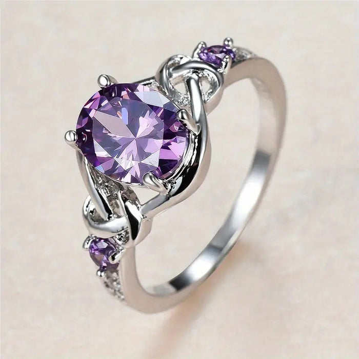 Anillo de princesa morado con incrustaciones Anillo de bobinado ovalado europeo y americano