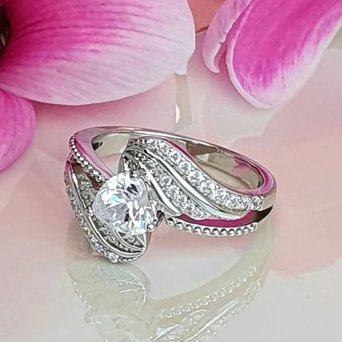 Anillo de amor con alas de plumas de ángel