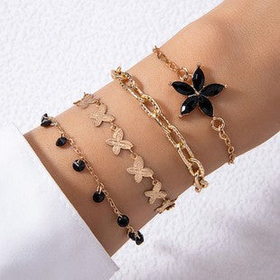 Conjunto de pulsera con colgante de trébol de cuatro hojas negro de estilo bohemio europeo: joyería con cadena de metal geométrica