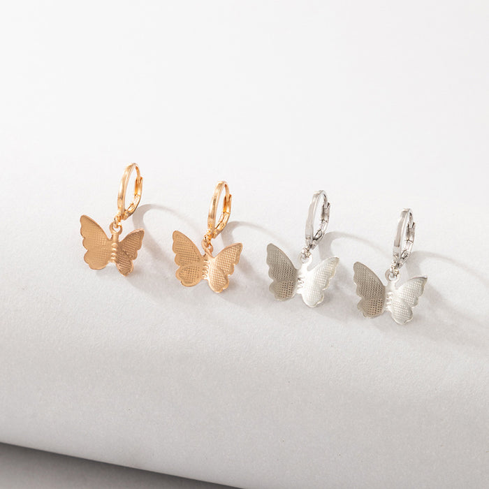 Conjunto de pendientes de mariposa con contraste de oro y plata