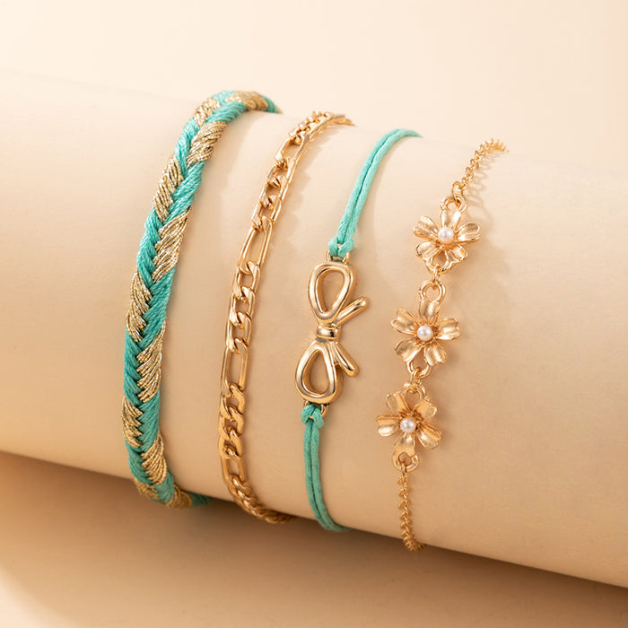 Conjunto de pulseras en capas con perlas y lazos y diseño de cordón trenzado