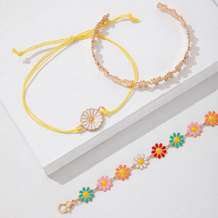 Conjunto de pulseras con flores de margaritas: joyería de mujer en tres piezas en tonos pastel