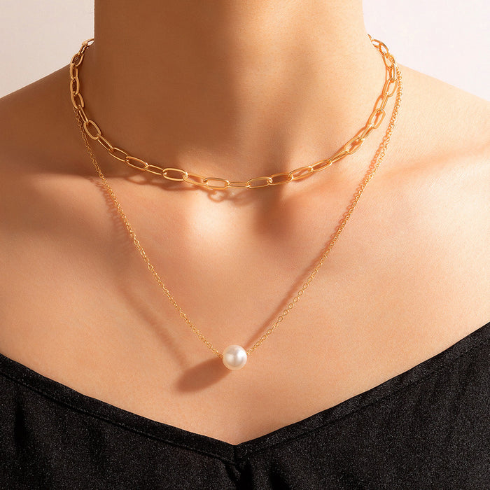 Collar de doble capa con perlas geométricas y diseño minimalista de gargantilla