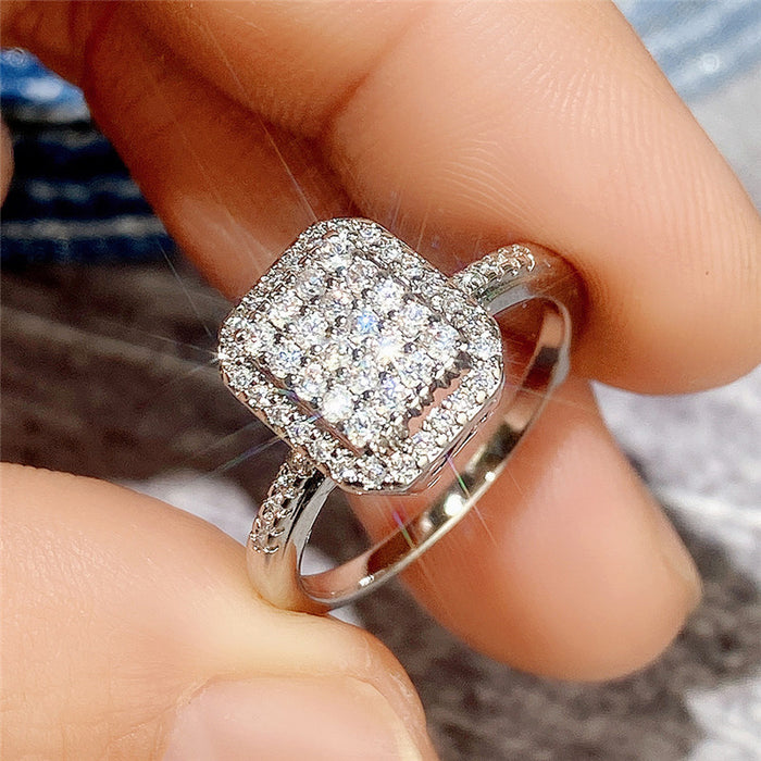 Anillo de plata bañado en cobre con circonitas y diamantes para mujer