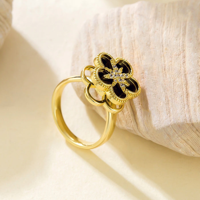 Wholesale black eight-pointed star five-petal flower rotating open ring