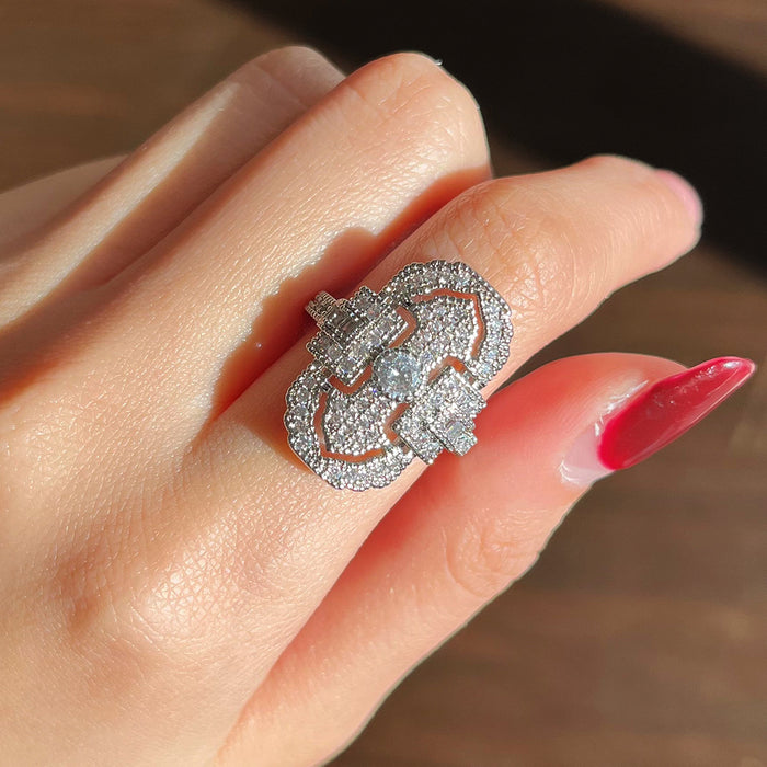 Green gemstone ring with multi-layer diamond design