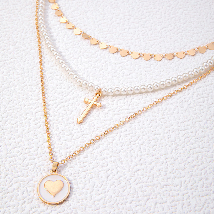 Heart Pendant Necklace with Cross and Pearl Charms - Geometric Multilayered Jewelry for Women