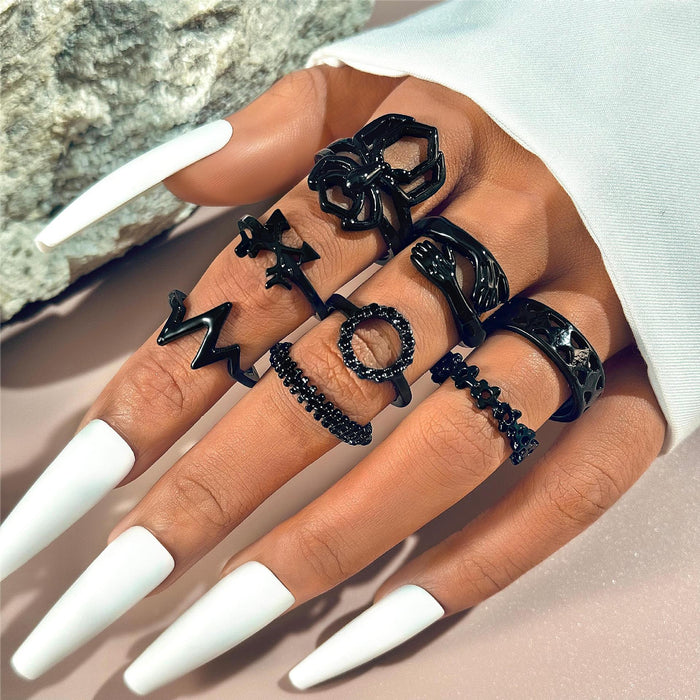 Juego de ocho anillos circulares con diseño de flechas y flores de Dark Love