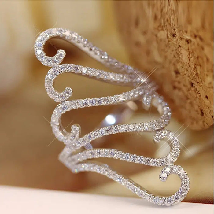 Long exaggerated hollow decorative ring, wave shell pattern ring