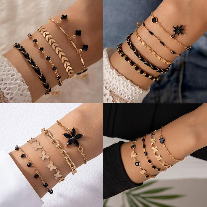 Conjunto de pulsera con colgante de trébol de cuatro hojas negro de estilo bohemio europeo: joyería con cadena de metal geométrica