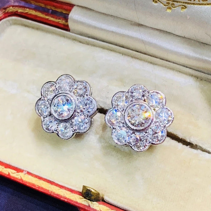 Women's flower stud earrings with diamonds