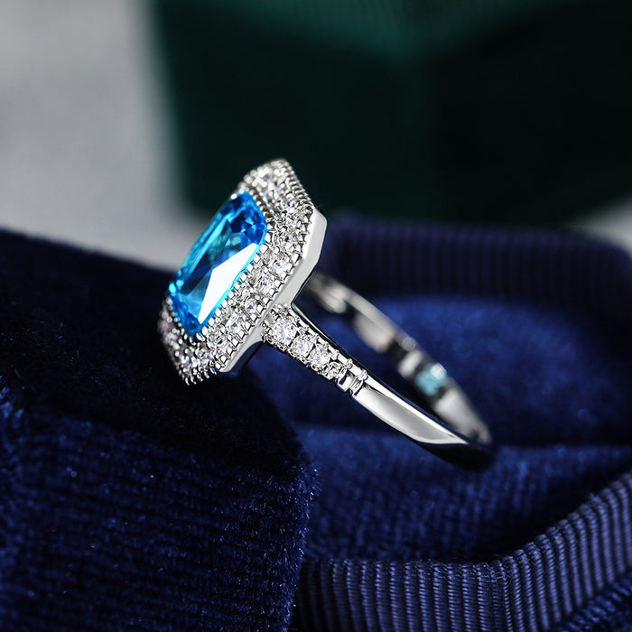 Anillo de mujer con circonita azul marino bañado en cobre y diseño de diamantes completos