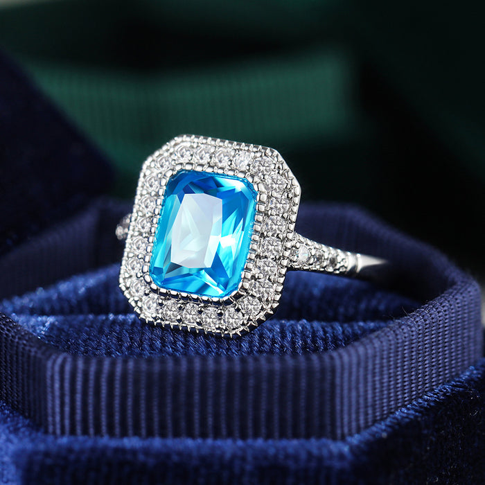 Anillo de mujer con circonita azul marino bañado en cobre y diseño de diamantes completos