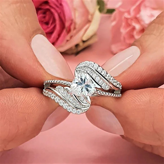 Anillo de amor con alas de plumas de ángel