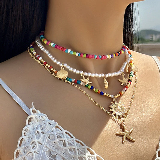 Conjunto de collar y pendientes con colgante y estrellas de mar bohemias