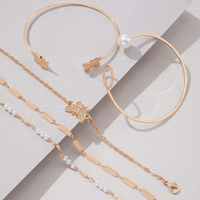 Conjunto de pulseras de cadena con forma de mariposa y perlas: cinco piezas de joyería con puños abiertos geométricos