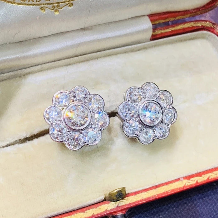 Women's flower stud earrings with diamonds