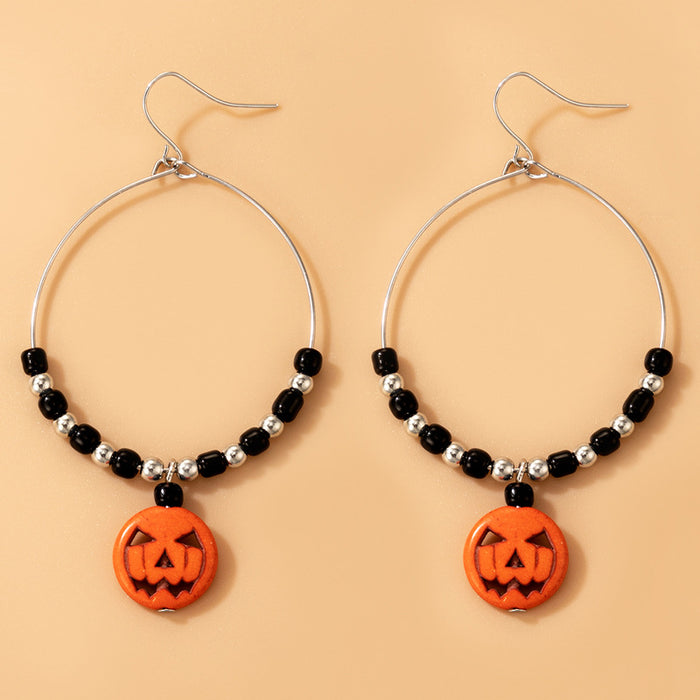 Pendientes de cuerda elástica con cuentas de arroz de colores y calaveras de Halloween